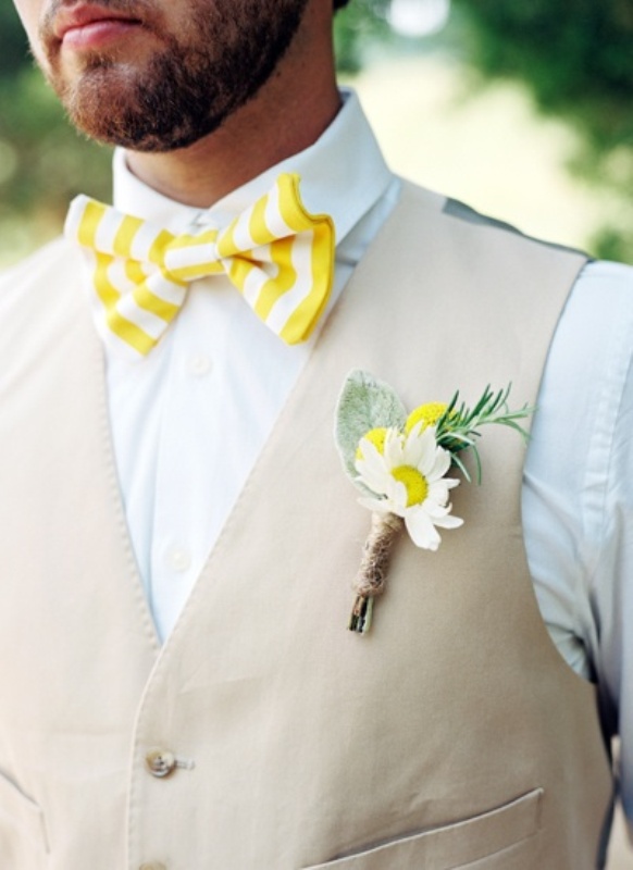 A cool spring look with a white shirt, a tan vest, a yellow and white striped bow and a bold boutonniere for a relaxed wedding