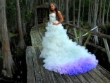 an ombre white to bright purple wedding dress train will make a statement with its bold color