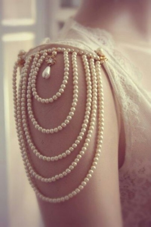 a gorgeous embellished sleeves of strands of pearls and with a tear drop pearl for an accent