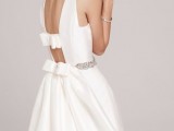 a beautifully cutout back with two large bows and an embellished sash will make your look very refined and chic