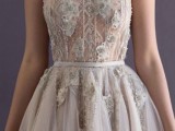 a beautifully embellished and embroidered wedding dress with floral appliques placed strategically