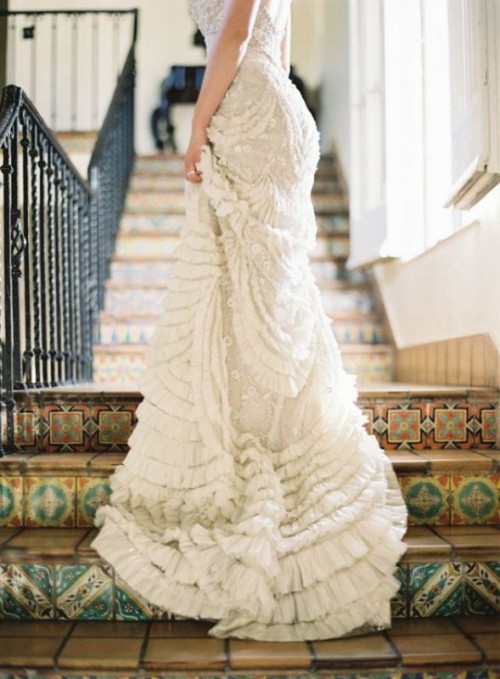 a ruffled wedding dress skirt with a train is a romantic and chic detailing idea to try