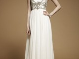 a simple neutral A-line wedding dress with catchy contrasting embellishments that cover and accent the bodice of the dress