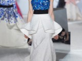 a contrasting bold blue floral bodice and a sculptural neutral skirt create a very bold and non-traditional look