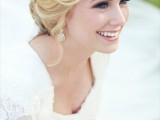 a relaxed updo with a single braid and some locks down is a chic idea