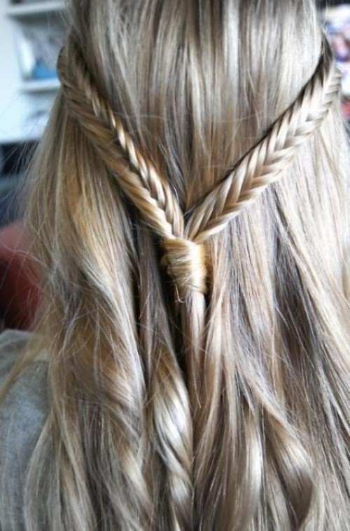 a textural half updo with two fishtail braids on top is a cool boho chic option
