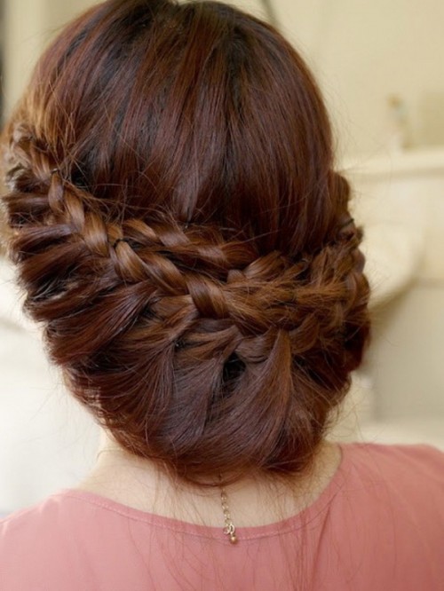 a low updo with several braids and much dimension is a proper idea for long hair