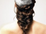 a sleek top plus a twisted and messy braid with much dimension and a veil is creative and relaxed option