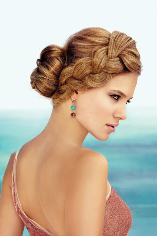 A low bun with a bump and a large braid on one side is a gorgeous and beautiful option