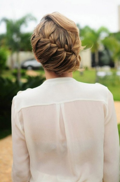 a low updo with a diagonal braid and locks down is an elegant and chic idea