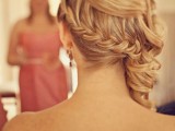 a half updo with a braided ponytail and waves on top is a unique and versatile hairstyle