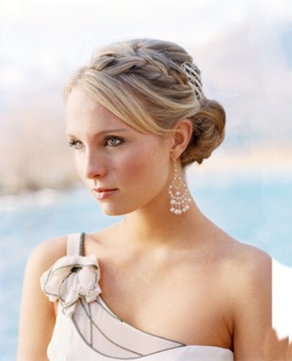A low bun with bangs to frame the face and a braid on top is a very elegant hairstyle