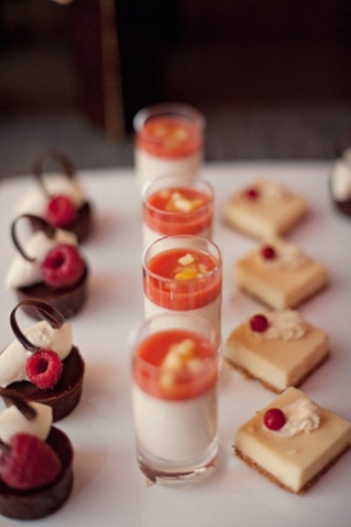 mini desserts chocolate and vanilla desserts with berries on top and panna cotta in shots