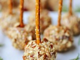 delicious mini cake pops covered with nuts and with edible pretzel sticks