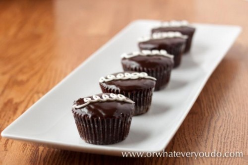 mini chocolate cupcakes with vanilla cream on top are a gorgeous decadent dessert