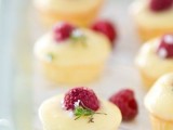 mini cheesecakes topped with glazing and raspberries will be a joy for everyone