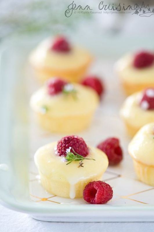 Mini cheesecakes topped with glazing and raspberries will be a joy for everyone