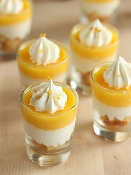 delicious mango mousse desserts with whipped cream on top are a very refreshing idea