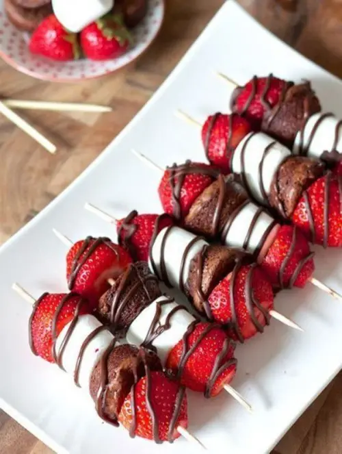 little marshmallow, brownie and strawberry kabobs with fudge sauce