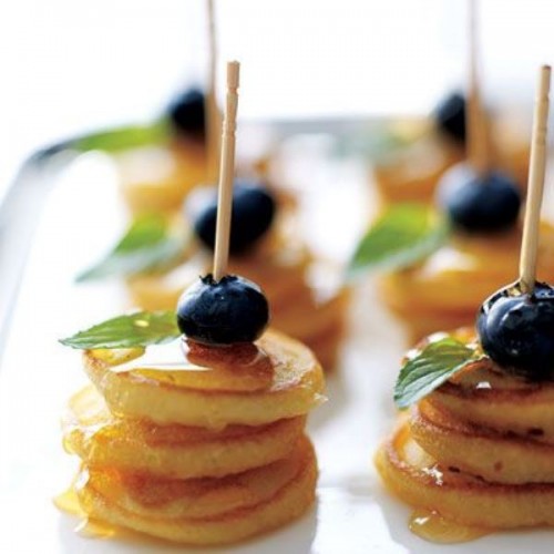 mini pancake kabobs with blueberries and honey on top is a tasty and hearty dessert idea
