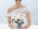 a chic and elegant neutral wedidng bouquet with grey foliage and ribbons is a cool idea for a bride who loves timeless things