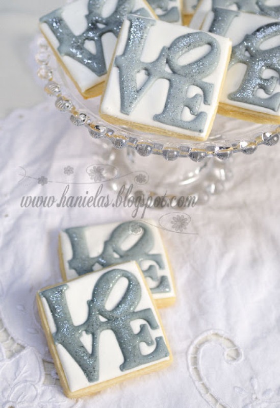 Glazed cookies with grey LOVE letters are nice for any modern wedding