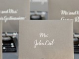 grey cards with white calligraphy are a cool idea for a modern wedding done in greys