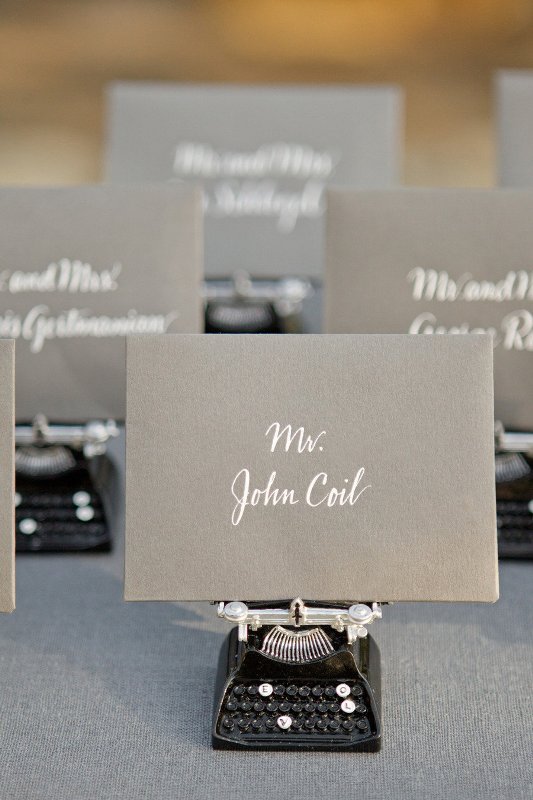 Grey cards with white calligraphy are a cool idea for a modern wedding done in greys