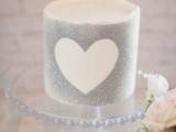 a silver grey wedding cake with a heart is a cool glam dessert for your wedding