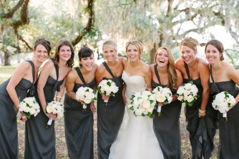 Elegant graphite grey one shoulder bridesmaid dresses with drapery and a strapless neckline