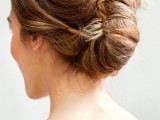 a chic twisted and a bit wavy ipdo with some volume on top is a stylsh idea for many bridal looks