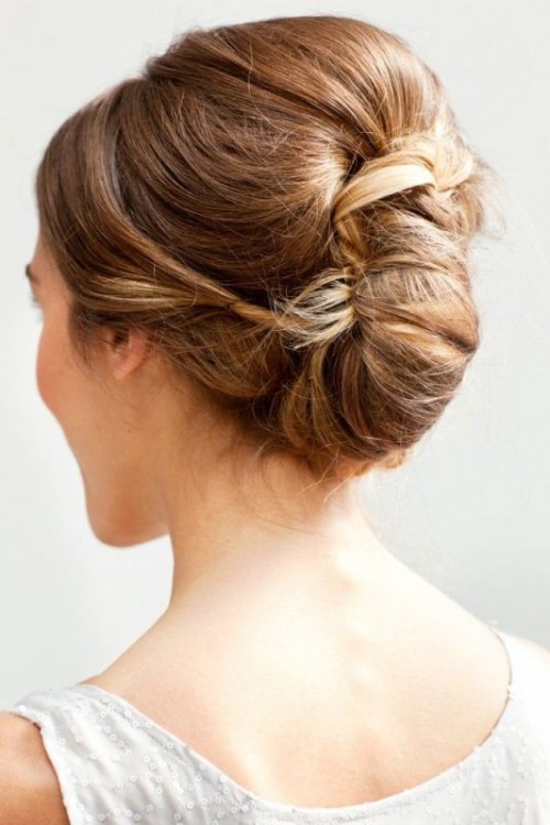 a chic twisted and a bit wavy ipdo with some volume on top is a stylsh idea for many bridal looks
