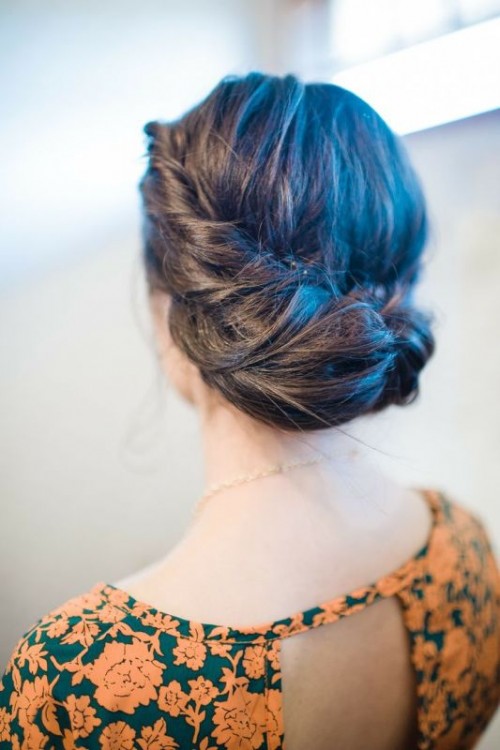 a braided and twsited halo updo is a lovely idea for a more relaxed and rustic bridal look