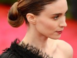 a minimalist twisted low bun with a sleek and wet hair top is a bold and cool idea to rock