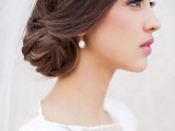 a stylish side updo hairstyle for a bride