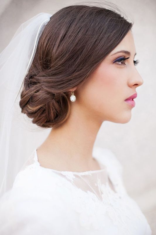 an elegant side low wedding updo with a sleek top is a timeless idea for many brides