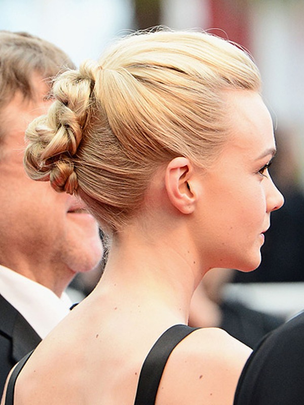 A braided updo with a volume on top is a stylish idea with a modern twist, rock it with many looks