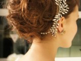 a super messy and wavy wedding updo with teased hair and an embellished headpiece is a refined idea for a modern and romantic bride