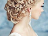a wavy and braided low updo with braids on both sides is a fabulous idea to go for and it looks fantastic