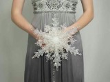 a unique Christmas wedding bouquet of a giant snowflake is a chic idea for a winter wedding