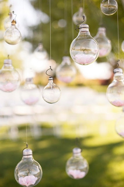 hanging bulbs with floating candles is a lovely installation for outdoors, and it can be hung anywhere