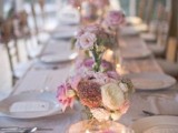 usual floral centerpieces paired up with floating bloom ones is a lovely idea for a flower-filled wedding