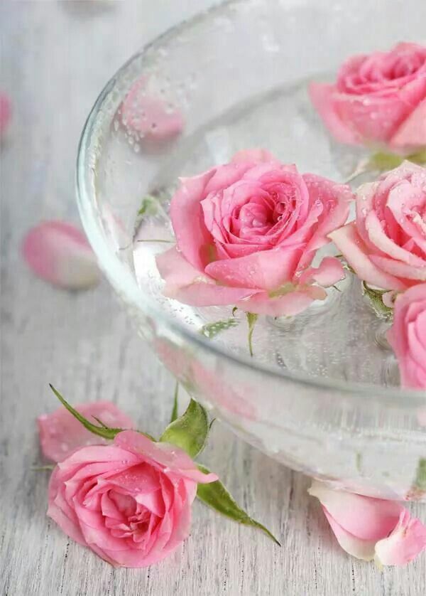 A bowl with floating pink roses is a lovely centerpiece or decoration for a wedding and it looks cool and fresh