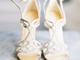 gorgeous and refined silver sparkling laser cut wedding shoes liek these ones will add a bit of glam to any bridal look