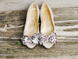shiny white wedding shoes with sequin bows on top are a playful and cool idea that every bride may rock