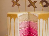 a pink ombre wedding cake with caramel drip and gold letter toppers is amazing with Valentine’s Day