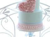 a romantic Valentine wedding cake in pink and mint, with a floral heart, ruffles is a chic and beautiful idea