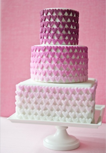 a modern Valentine wedding cake with heart decorated tiers with an ombre effect is a beautiful and bold idea