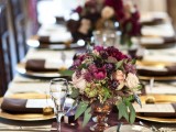 a bright vineyard wedding centerpiece in blush and burgundy, with greenery will fit most of fall weddings