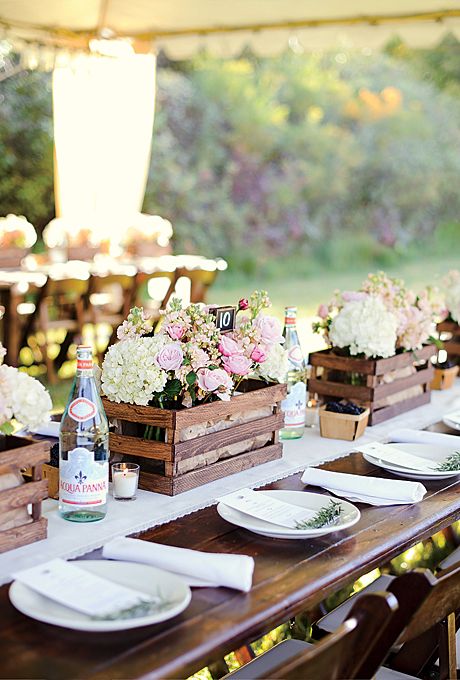 crates with neutral and pastel blooms and some greenery are nice and simple centerpieces for any wedding with a relaxed feel